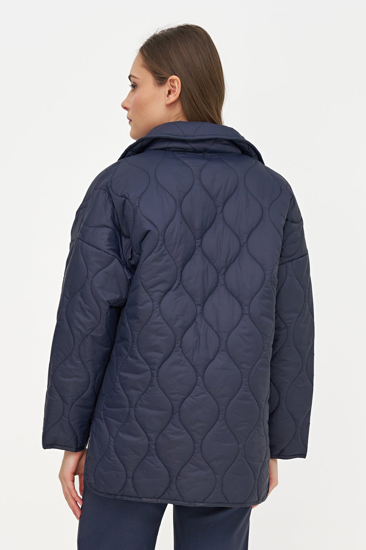 Women's Quilted Long Sleeve Jacket, with Front Patch Pockets & a Snap Closure System. Adorned with a Beautiful Snake Printed Lining