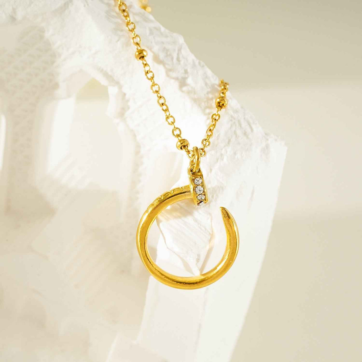 CSENGE Gold Necklace:  Zirconia Embedded Circular Nail Pendant on a Satellite Beaded Chain