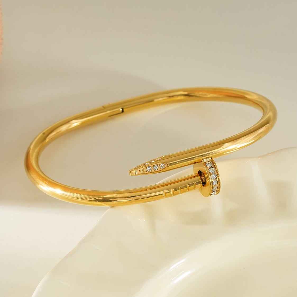 DAVIDKA Gold: Zirconia Embedded Industrial-Chic Twisted Nail Bracelet