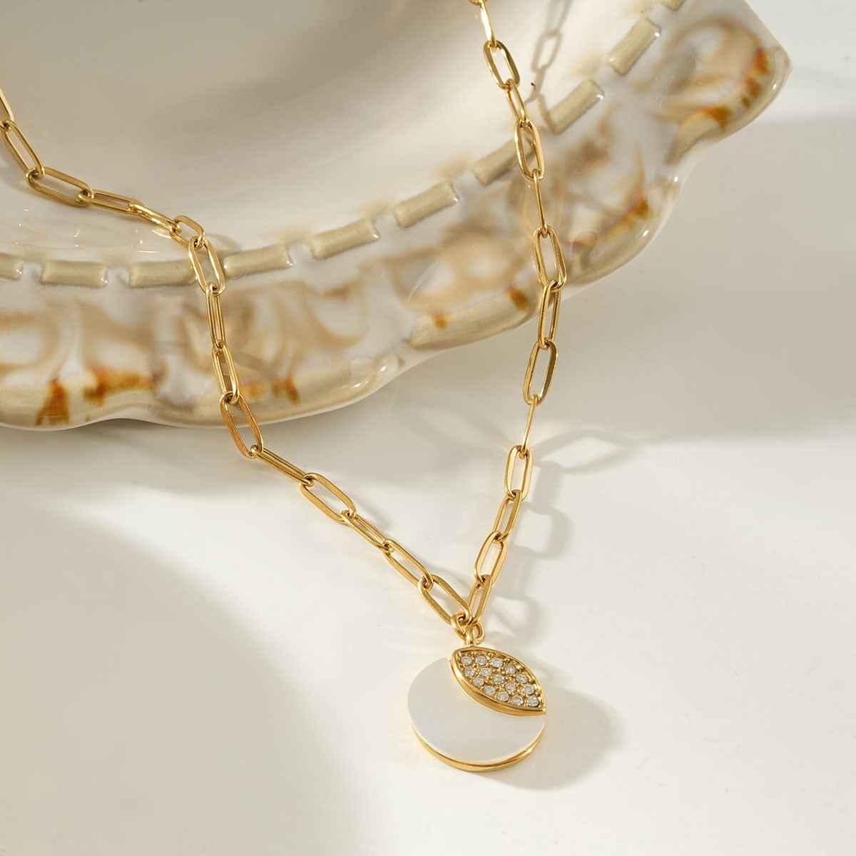 MOGGNA Gold: Coastal Shell Charm Necklace with Oval-Cut Zirconia Inlay