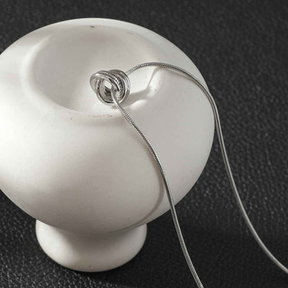 ALEKI Silver (White Gold): Sculptural Knot Pendant Necklace