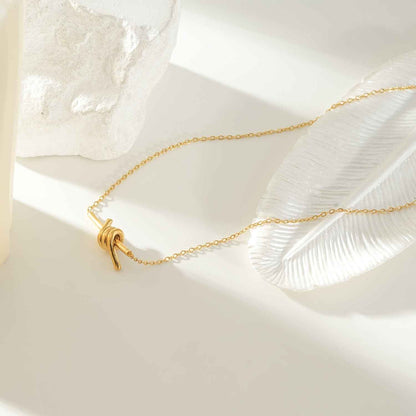 LARISA Gold: Bar Pendant Necklace with Knotted Symbol Detail