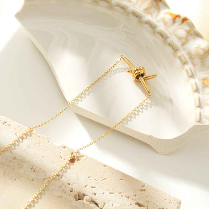 LARISA Gold: Bar Pendant Necklace with Knotted Symbol Detail
