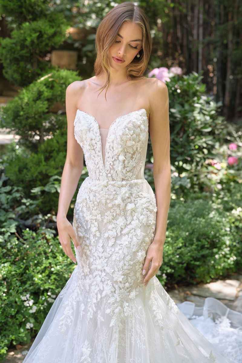 mermaid gown features a strapless lace-up closure for adjustable support